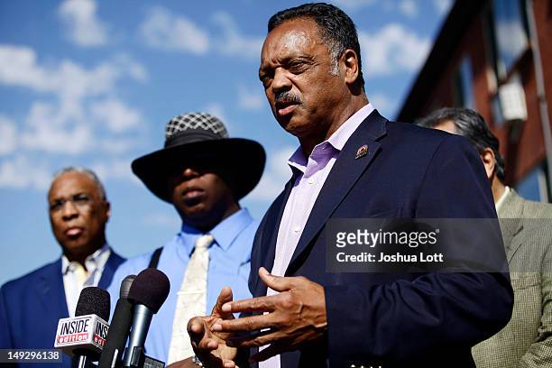 Civil rights activist Reverend Jesse Jackson speaks during a news conference outside of the apartment building where accused murderer James Holmes...