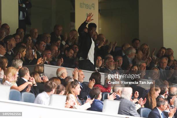 Spectators applaud Vinicius Junior of Real Madrid in the stands during the LaLiga Santander match between Real Madrid CF and Rayo Vallecano at...