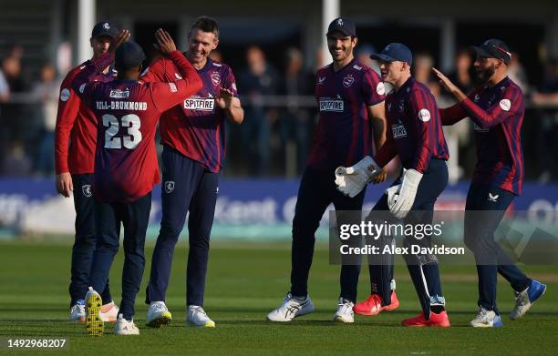 Michael Hogan of Kent Spitfires celebrates taking the wicket of Chris Dent of Gloucestershire with teammates during the Vitality Blast T20 match...