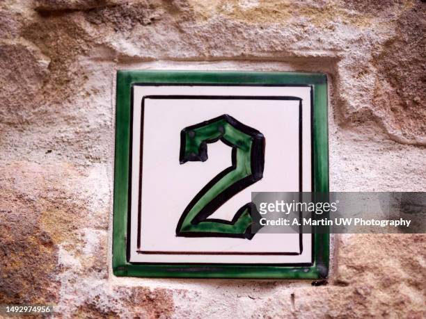 artisan house number 2 - handcrafted tile on stone wall - 2nd street stock pictures, royalty-free photos & images