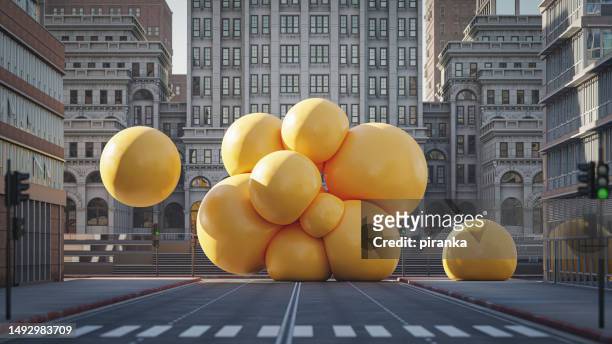 bunch of big spheres in the city - balloons concept stockfoto's en -beelden
