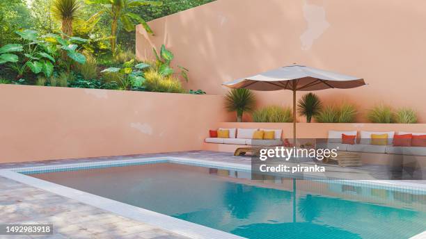 pool in a tropical setting - peach colour stockfoto's en -beelden