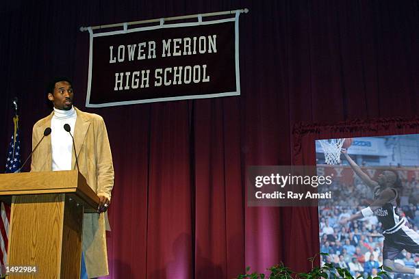 Kobe Bryant of the Los Angeles Lakers addresses a capacity crowd at his old high school where his former uniform number is retired by Lower Meridian...