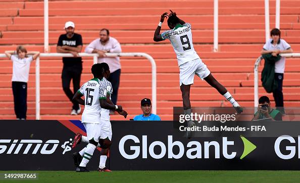Salim Fago Lawal of Nigeria celebrates with teammate Jude Sunday