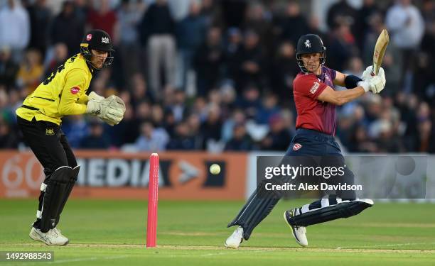 Joe Denly of Kent hits runs watched on by James Bracey of Gloucestershire during the Vitality Blast T20 match between Kent Spitfires and...