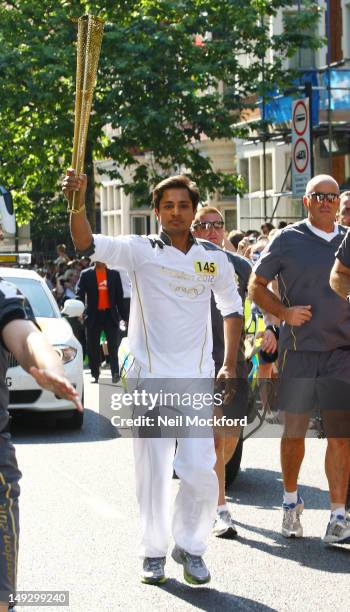 Aditya Mittal, son of Lakshmi Niwas Mittal, with The Olympic Torch On Day 69 Of The Olympic Torch Relay on July 26, 2012 in London, England.