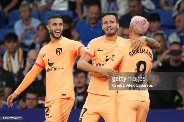 Saul Niguez of Atletico Madrid celebrates with Mario Hermoso and Antoine Griezmann after scoring the team's first goal during the LaLiga Santander...