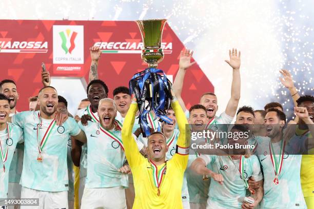 Samir Handanovic of FC Internazionale lifts the Coppa Italia trophy after their side's victory in the Coppa Italia Final match between ACF Fiorentina...