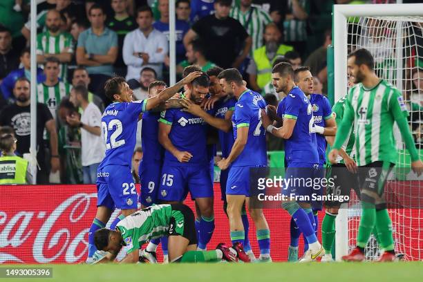 Omar Alderete of Getafe CF celebrates with team mates after scoring the team's first goal during the LaLiga Santander match between Real Betis and...