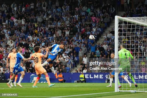 Vinicius Souza of RCD Espanyol scores the team's third goal past Ivo Grbic of Atletico Madrid during the LaLiga Santander match between RCD Espanyol...