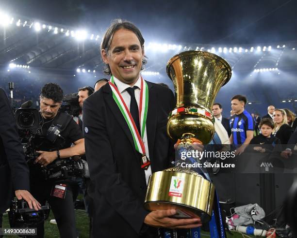 Simone Inzaghi, Head Coach of FC Internazionale, pose for a photograph with the Coppa Italia trophy after victory in the Coppa Italia Final match...