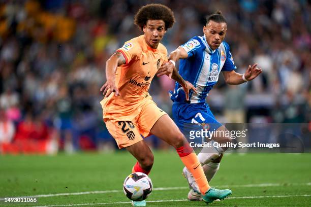 Axel Witsel of Atletico de Madrid compete for the ball with Martin Braithwaite of RCD Espanyol during the LaLiga Santander match between RCD Espanyol...