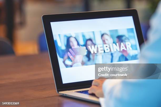 businessman waiting for a webinar to begin. - young businessman using a virtual screen stockfoto's en -beelden