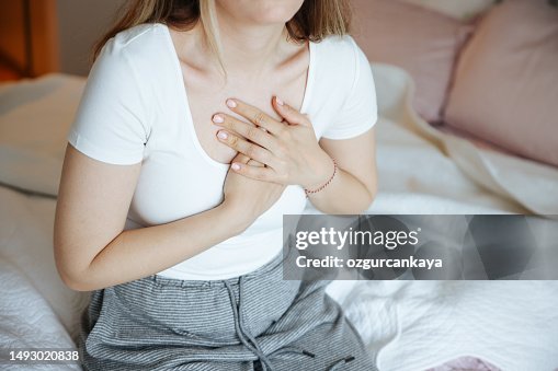 Heart attack, women with chest pain suffering at home Heart attack, women with chest pain suffering at home