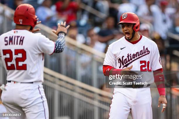 Keibert Ruiz of the Washington Nationals reacts after scoring a run against the San Diego Padres during the second inning at Nationals Park on May...