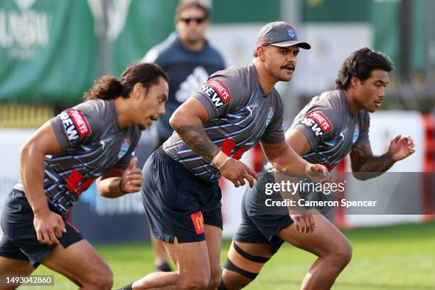 Latrell Mitchell of the Blues and team mates warm up during a New South Wales Blues State of Origin training session at Coogee Oval on May 25, 2023...