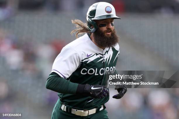 Charlie Blackmon of the Colorado Rockies scores on a Jurickson Profar double against the Miami Marlins in the first inning at Coors Field on May 24,...
