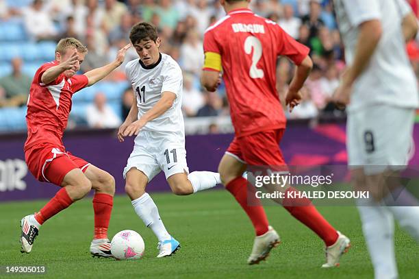 Belarus’s Solovei Artem vies with New Zealand’s Rojas Marco during the 2012 London Olympic Games men's football match between Belarus and New Zealand...