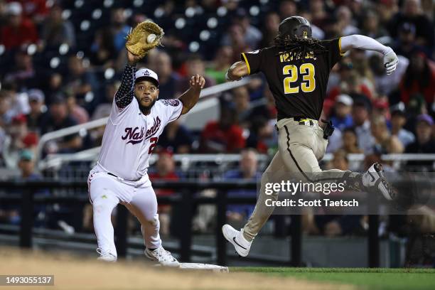 Dominic Smith of the Washington Nationals makes a catch to retire Fernando Tatis Jr. #23 of the San Diego Padres during the seventh inning at...