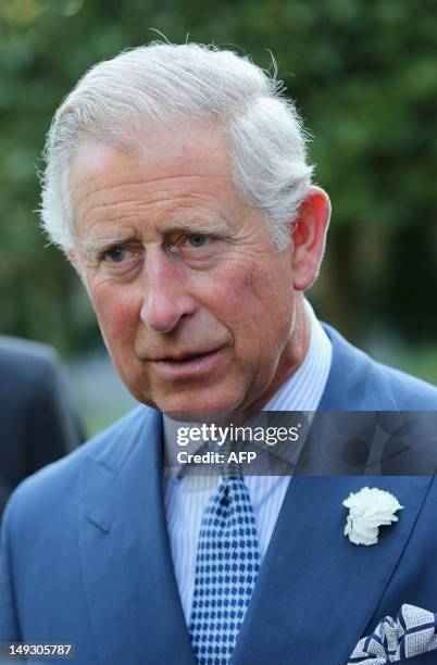 Prince Charles, the Prince of Wales, looks on during a reception for delegates of the Global Investment Conference at the Clarence House garden on...