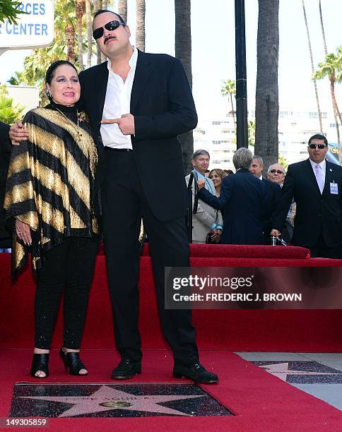 Latin singing star Pepe Aguilar poses with his mother Flor Silvestre on his unveiled Star on the Hollywood Walk of Fame on July 26, 2012 in...