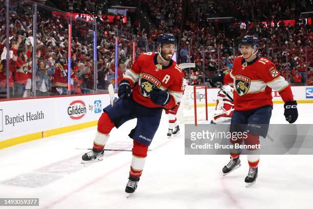 Matthew Tkachuk of the Florida Panthers celebrates with Anton Lundell after scoring a goal on Frederik Andersen of the Carolina Hurricanes during the...