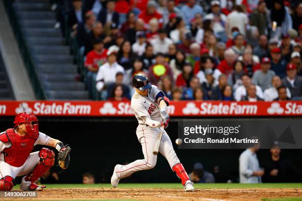 Enrique Hernandez of the Boston Red Sox hits a rbi double against the Los Angeles Angels in the fourth inning at Angel Stadium of Anaheim on May 24,...