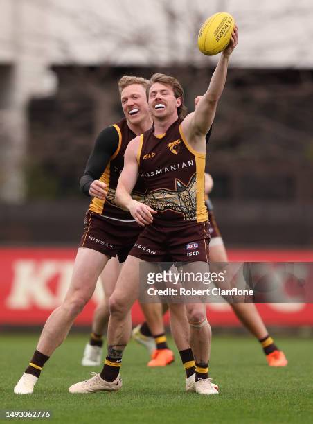 Lachlan Bramble of the Hawks is challenged by James Sicily of the Hawks during a Hawthorn Hawks AFL training session at Waverley Park on May 25, 2023...