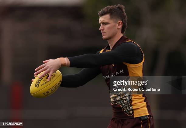 Mitch Lewis of the Hawks controls the ball during a Hawthorn Hawks AFL training session at Waverley Park on May 25, 2023 in Melbourne, Australia.