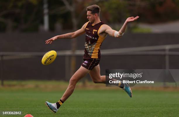 Fergus Greene of the Hawks kicks the ball during a Hawthorn Hawks AFL training session at Waverley Park on May 25, 2023 in Melbourne, Australia.