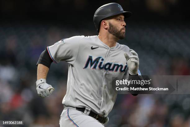 Jacob Stallings of the Miami Marlins hits a double against the Colorado Rockies in the fifth inning at Coors Field on May 24, 2023 in Denver,...