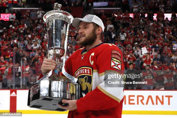 Aleksander Barkov of the Florida Panthers celebrates with the Prince of Wales Trophy after defeating the Carolina Hurricanes in Game Four to win the...