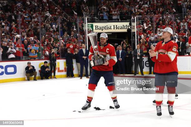 Aleksander Barkov of the Florida Panthers celebrates with the Prince of Wales Trophy after defeating the Carolina Hurricanes in Game Four to win the...