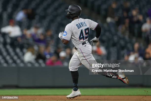 Jonathan Davis of the Miami Marlins circles the bases after hitting a solo home run against the Colorado Rockies in the sixth inning at Coors Field...