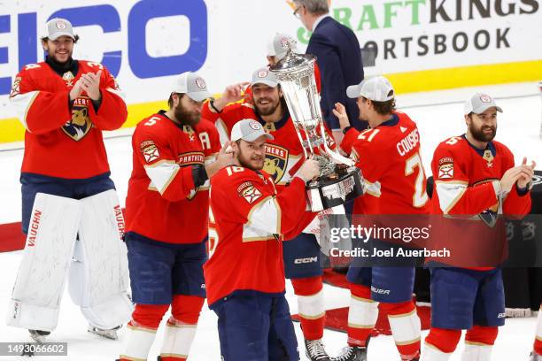 Aleksander Barkov of the Florida Panthers celebrates with the Prince of Wales Trophy after defeating the Carolina Hurricanes in Game Four to win the...