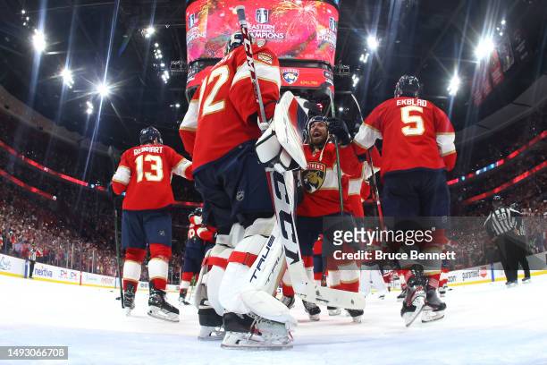 Ryan Lomberg and Sergei Bobrovsky of the Florida Panthers celebrate after defeating the Carolina Hurricanes in Game Four to win the Eastern...