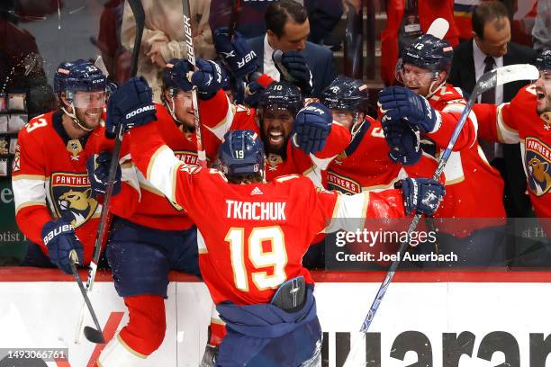 Matthew Tkachuk of the Florida Panthers celebrates with his teammates after scoring the game winning goal on Frederik Andersen of the Carolina...