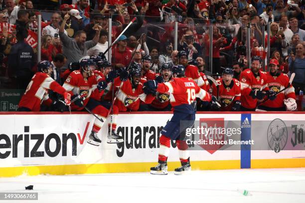 Matthew Tkachuk of the Florida Panthers celebrates with his teammates after scoring the game winning goal on Frederik Andersen of the Carolina...