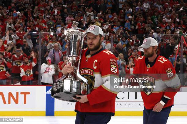 Aleksander Barkov of the Florida Panthers celebrates with the Prince of Wales Trophy after defeating the Carolina Hurricanes in Game Four to win the...