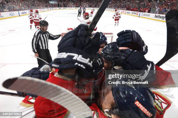 Ryan Lomberg of the Florida Panthers celebrates with his teammates after scoring a goal on Frederik Andersen of the Carolina Hurricanes during the...