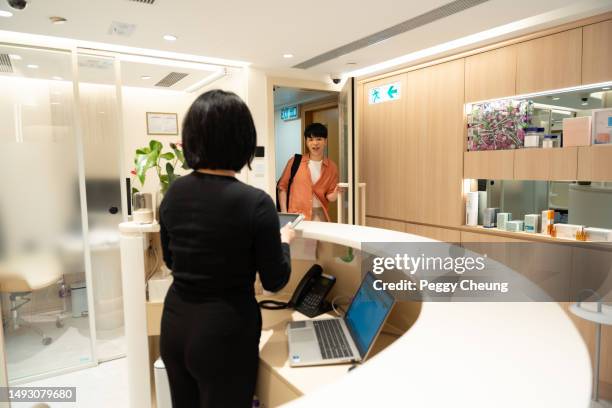 an asian young male is entering a beauty centre. - consultation lake bildbanksfoton och bilder