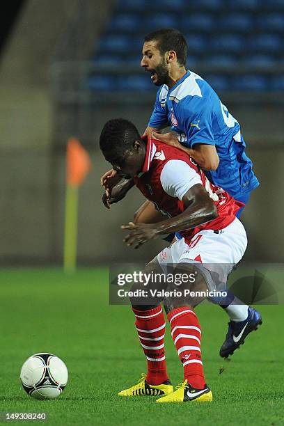 Djamel Abdoun of Olympiacos FC is challenged by Elderson of Braga during a pre-Season friendly match between Olympiacos FC and Braga on July 26, 2012...