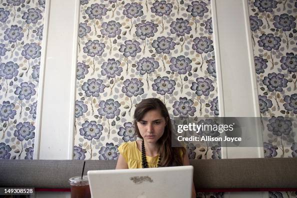 Compu Matilde Matilde Hoffman works on her computer at a coffee shop July 25, 2012 ...