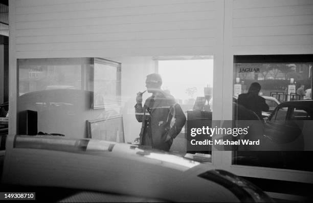 English racing driver Mike Hawthorn at his Tourist Trophy Garage Ltd. On East Street, Farnham, Surrey, UK, 5th January 1959.