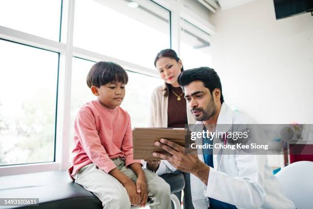 boy, you see this video, very funny. - doctor visit stock pictures, royalty-free photos & images