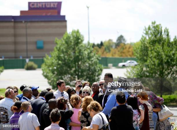 Civil rights activist Reverend Jesse Jackson leads a prayer with members of Alex Sullivan's family at a memorial across the street from the Century...