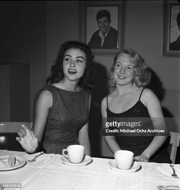 Julie Newmar and other "young stars of Paramount Pictures" attend a party to celebrate newly minted star Bob Ivers and the release of their film...