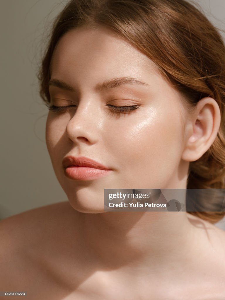 Portrait Of A Woman With Clean Moist Skin In The Sunlight High Res Portrait Of A Woman With Clean Moist Skin In The Sunlight High Res