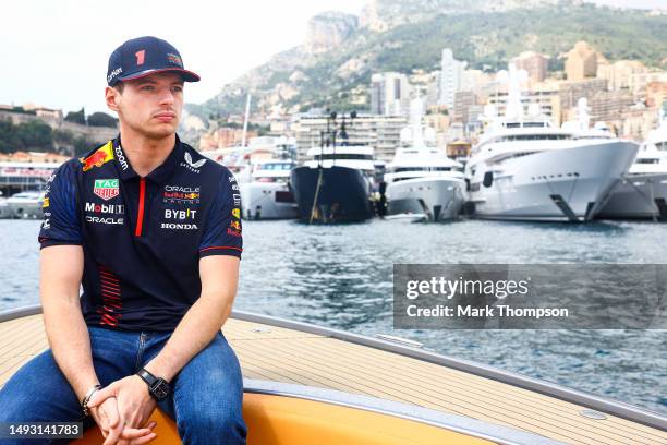 Max Verstappen of the Netherlands and Oracle Red Bull Racing rides into the paddock on a boat during previews ahead of the F1 Grand Prix of Monaco at...