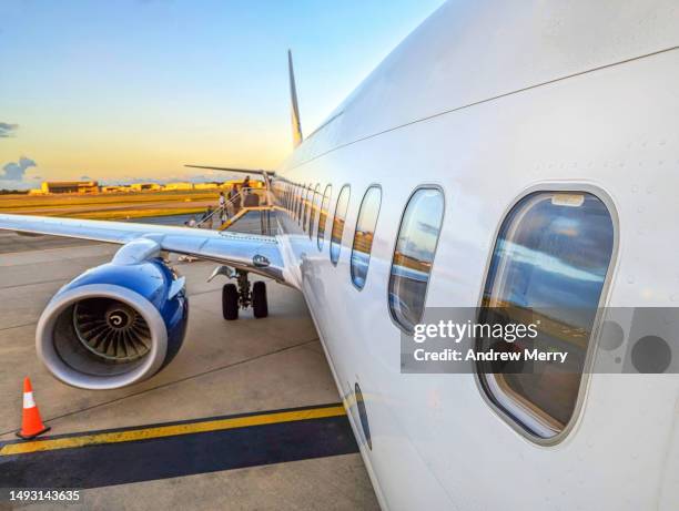 airplane boarding outdoor stairs, airport at dusk - generic location stock pictures, royalty-free photos & images